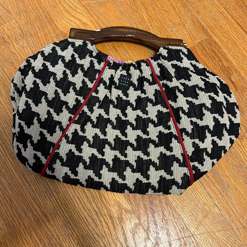 Custom made reversible clutch bag with wooden handles.